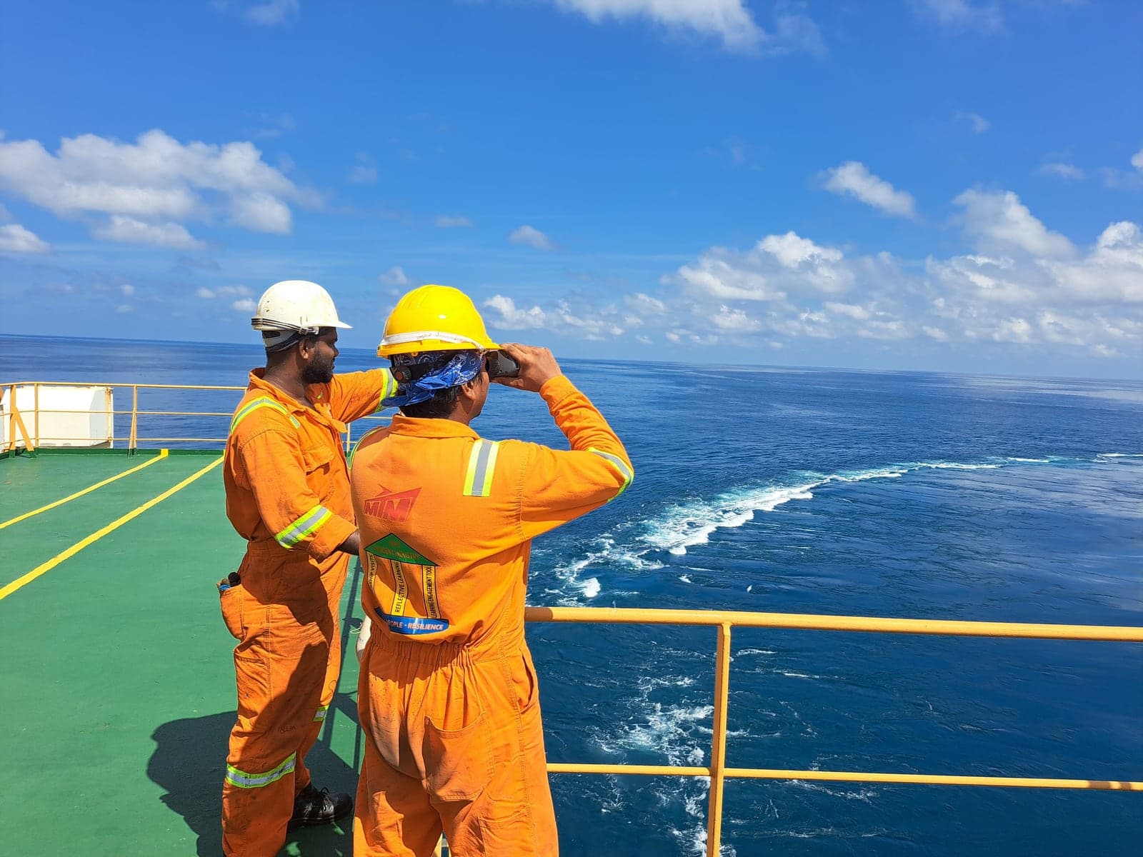 Ship's crew observing the horizon on deck